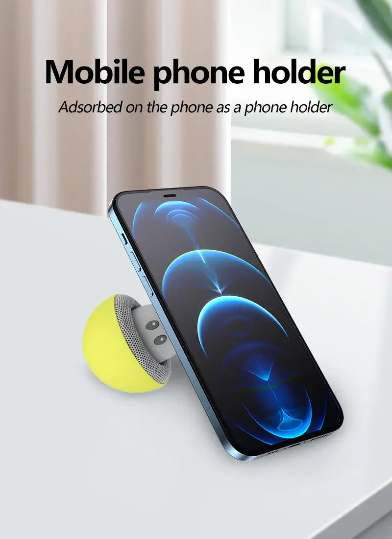 Wireless speaker with suction phone stand